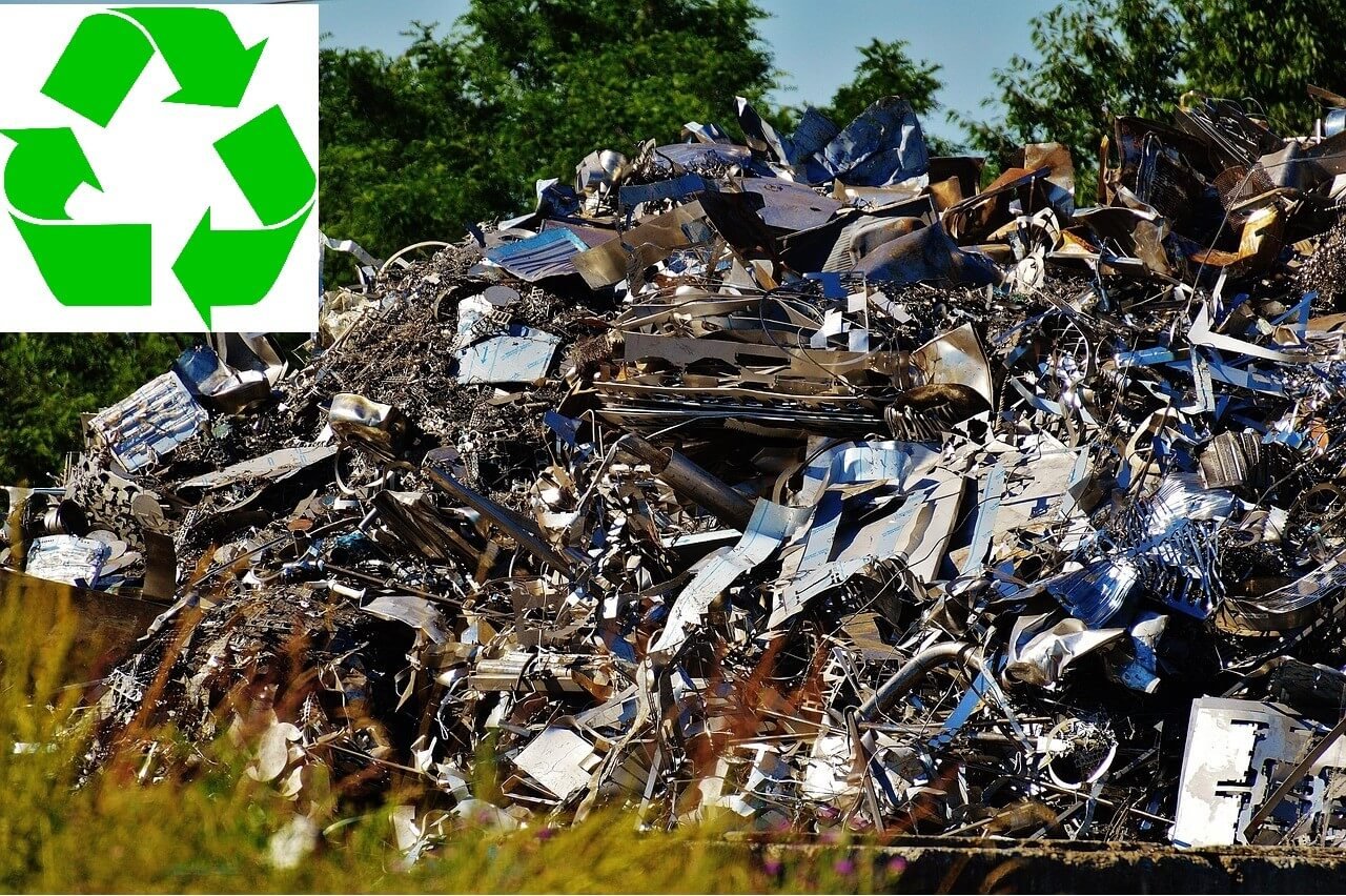 Piles of Old Electronics with Recycling Arrows Overlay